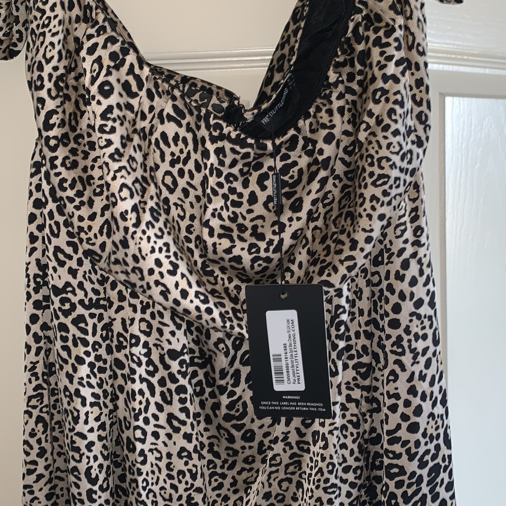 NWT never worn cheeta print dress with slit in front size 14 silky
